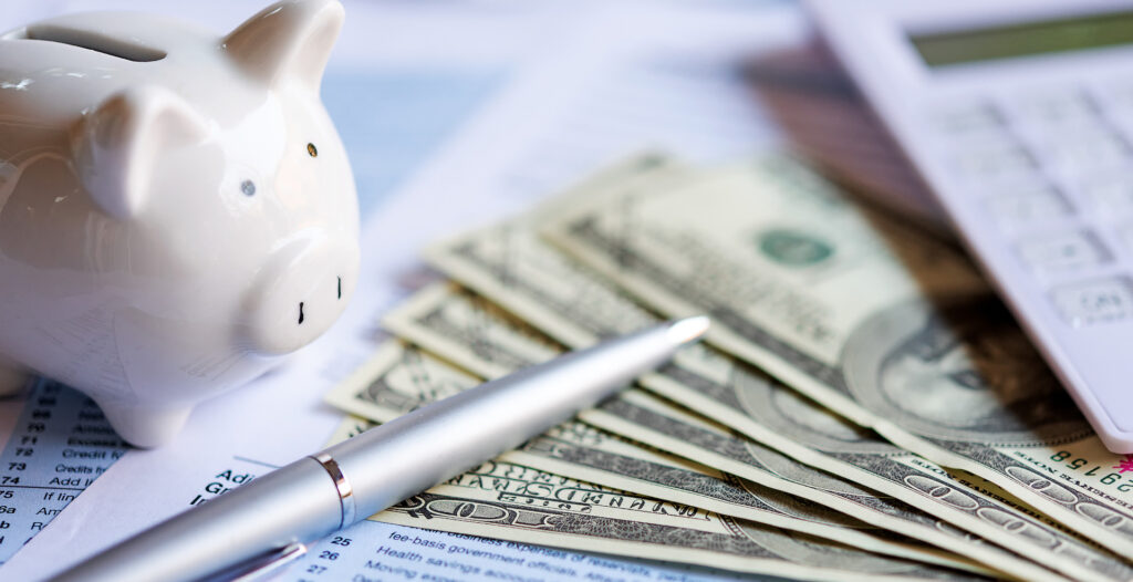 Money and Pen on Desk